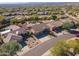 Aerial view of houses and neighborhood with mountain background at 16544 N 105Th St, Scottsdale, AZ 85255