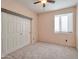 Simple bedroom with carpet, ceiling fan and closet at 16544 N 105Th St, Scottsdale, AZ 85255