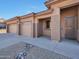 Two-car garage with covered entry and desert landscaping at 16544 N 105Th St, Scottsdale, AZ 85255