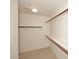 Spacious walk-in closet with double hanging rods and shelving at 20107 N 110Th N Ave, Sun City, AZ 85373