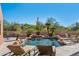 Inviting pool with waterfall feature, surrounded by lounge chairs and desert landscaping at 23461 N 80Th Way, Scottsdale, AZ 85255
