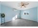 Spacious light blue bedroom with tile floors and ceiling fan at 28480 N Bryce Trl, San Tan Valley, AZ 85144