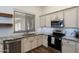 Kitchen corner with granite countertops and stainless steel appliances at 28480 N Bryce Trl, San Tan Valley, AZ 85144