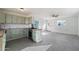 Bright kitchen with green cabinets, butcher block countertops, and tile floors at 28480 N Bryce Trl, San Tan Valley, AZ 85144