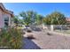 Landscaped yard with gravel, desert plants, and trees at 221 N Agua Fria Ln, Casa Grande, AZ 85194