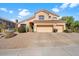 Two-story home with a three-car garage and well-manicured landscaping at 7360 E Rustling Pass, Scottsdale, AZ 85255