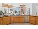 Gourmet kitchen boasts granite countertops, stainless steel appliances, and custom cabinetry at 23461 N 80Th Way, Scottsdale, AZ 85255