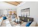 Gathering room with kitchen view and wood beam ceiling at 23461 N 80Th Way, Scottsdale, AZ 85255