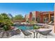 Expansive pool with a large patio and desert landscaping at 23461 N 80Th Way, Scottsdale, AZ 85255