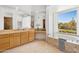 Luxurious bathroom with soaking tub, double vanity, and a view at 23461 N 80Th Way, Scottsdale, AZ 85255