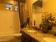 Bathroom with double vanity, shower, and bathtub at 6216 W Hedgehog Pl, Phoenix, AZ 85083