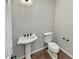 Clean powder room with pedestal sink and tile flooring at 12446 W Bajada Rd, Peoria, AZ 85383