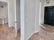 Bright entry hall with tile flooring, powder room, and access to other rooms at 12446 W Bajada Rd, Peoria, AZ 85383