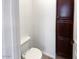 Convenient half bathroom with dark wood cabinetry at 12446 W Bajada Rd, Peoria, AZ 85383