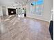 Open and spacious great room with tile flooring and kitchen island at 12446 W Bajada Rd, Peoria, AZ 85383