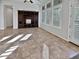 Living area with tile floors and built-in entertainment center at 12446 W Bajada Rd, Peoria, AZ 85383