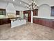 Kitchen with island, stainless steel appliances, and dark wood cabinets at 12446 W Bajada Rd, Peoria, AZ 85383