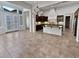 Elegant kitchen with dark wood cabinets, island, and breakfast nook at 12446 W Bajada Rd, Peoria, AZ 85383