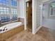 Elegant bathroom featuring a soaking tub and walk-in shower at 12446 W Bajada Rd, Peoria, AZ 85383