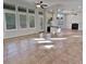 Open concept great room with tile floors, fireplace, and abundant natural light at 12446 W Bajada Rd, Peoria, AZ 85383