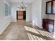 Bright dining room with tile floors, chandelier, and built-in cabinetry at 12446 W Bajada Rd, Peoria, AZ 85383