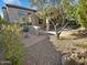 Landscaped backyard oasis with gravel, plants, and patio at 12446 W Bajada Rd, Peoria, AZ 85383
