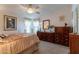 Spacious bedroom with large dresser and ceiling fan at 201 S Greenfield Rd # 176, Mesa, AZ 85206