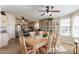 Well-lit dining area with a table and chairs near the kitchen at 201 S Greenfield Rd # 176, Mesa, AZ 85206