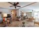 Open concept living room with a view into the kitchen and dining area at 201 S Greenfield Rd # 176, Mesa, AZ 85206