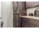 Laundry room with stackable washer and dryer, granite countertop at 14950 W Mountain View Blvd # 4205, Surprise, AZ 85374
