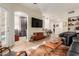Living room with open concept to kitchen and access to patio at 14950 W Mountain View Blvd # 4205, Surprise, AZ 85374