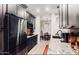 Modern kitchen with dark cabinetry, granite countertops and stainless steel appliances at 14950 W Mountain View Blvd # 4205, Surprise, AZ 85374