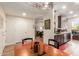 Copper dining table with four chairs, view into living room and kitchen at 14950 W Mountain View Blvd # 4205, Surprise, AZ 85374