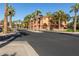 Palm tree-lined street showcasing a desirable community of upscale apartments at 14950 W Mountain View Blvd # 4205, Surprise, AZ 85374