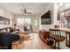 Spacious living room featuring a comfortable leather couch and a large TV at 14950 W Mountain View Blvd # 4205, Surprise, AZ 85374