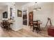 Open concept dining area with kitchen view and breakfast bar at 14950 W Mountain View Blvd # 4205, Surprise, AZ 85374