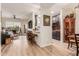 Open floor plan with kitchen, granite counters, stainless steel appliances, and living room with leather couch at 14950 W Mountain View Blvd # 4205, Surprise, AZ 85374