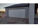 Attached garage with white sectional door at 14794 N Dogwood Rd, Florence, AZ 85132