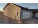 Attached garage with white sectional door at 14794 N Dogwood Rd, Florence, AZ 85132