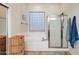 Clean bathroom with a shower, bathtub, and plenty of storage at 2412 W Crimson Ter, Phoenix, AZ 85085