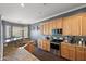 Spacious kitchen with granite countertops and light wood cabinets at 2412 W Crimson Ter, Phoenix, AZ 85085