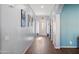 Bright hallway with tile floors and neutral walls at 2412 W Crimson Ter, Phoenix, AZ 85085