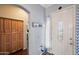 Inviting entryway with wood cabinets and a decorative bird statue at 2412 W Crimson Ter, Phoenix, AZ 85085