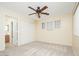 Bright bedroom with ceiling fan and carpet at 12626 W Indianola Ave, Avondale, AZ 85392