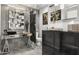 Modern bathroom with a unique vanity, large mirror, and dark cabinetry at 8614 E Berridge Ln, Scottsdale, AZ 85250