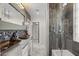 Bathroom with double vanity, glass shower, and modern finishes at 8614 E Berridge Ln, Scottsdale, AZ 85250