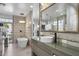 Spa-like bathroom with soaking tub, double sinks, and walk-in shower at 8614 E Berridge Ln, Scottsdale, AZ 85250