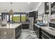 Gourmet kitchen features a large island, stainless steel appliances, and stylish pendant lighting at 8614 E Berridge Ln, Scottsdale, AZ 85250
