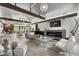 Open living area with fireplace, hardwood floors, and modern furniture at 8614 E Berridge Ln, Scottsdale, AZ 85250