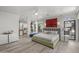 Main bedroom with king-size bed and access to the bathroom and patio at 8614 E Berridge Ln, Scottsdale, AZ 85250